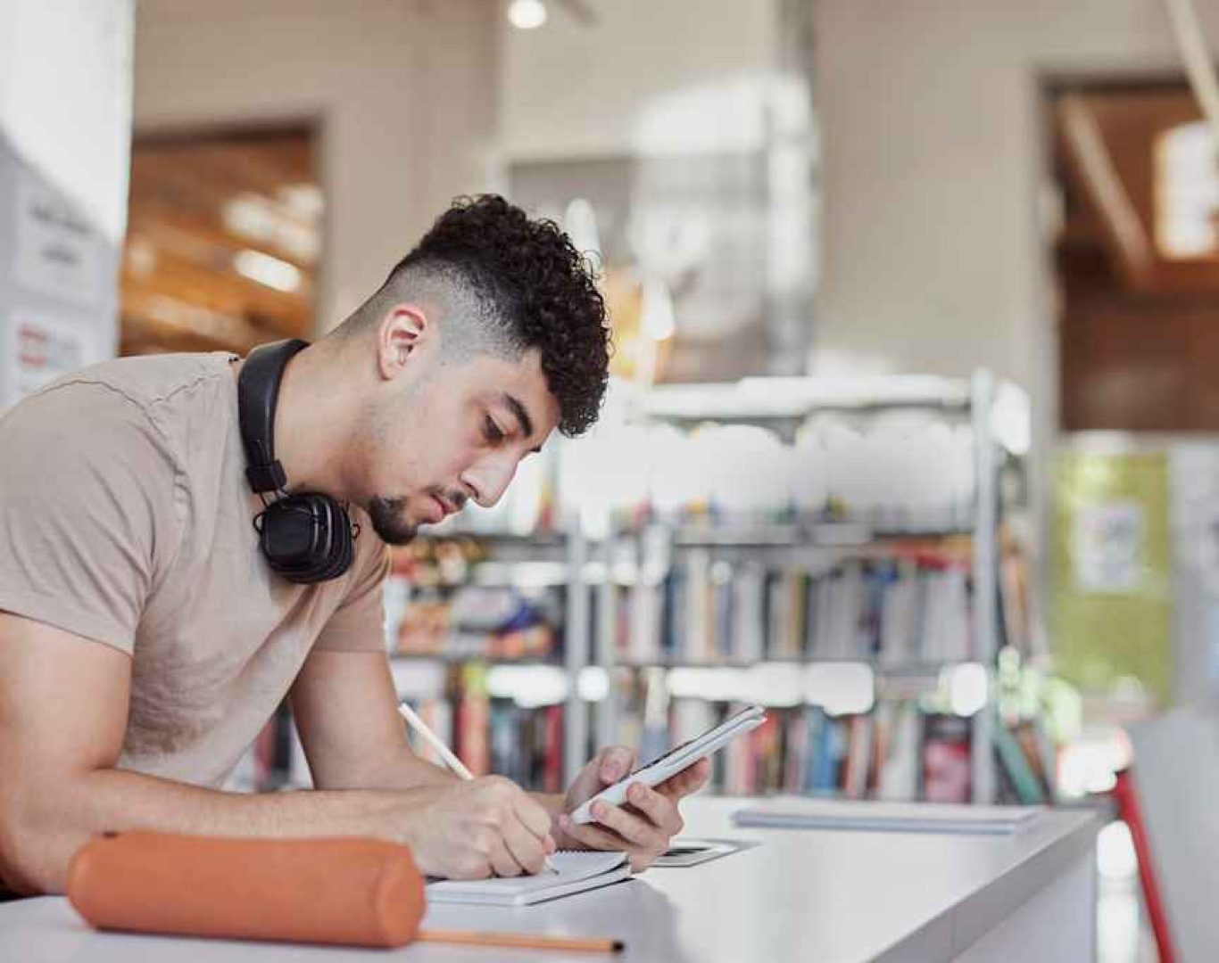 Graduate holding diploma at Texcel Trade School commencement